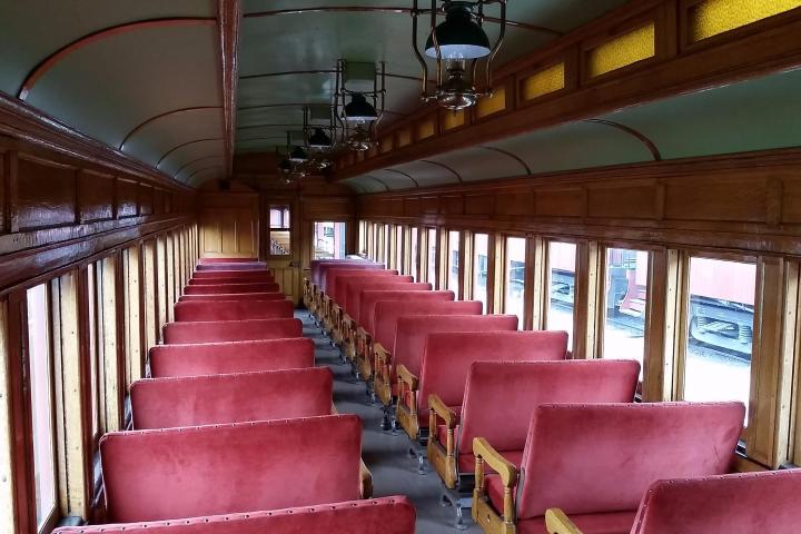 Rows of bench coach seating on a train.