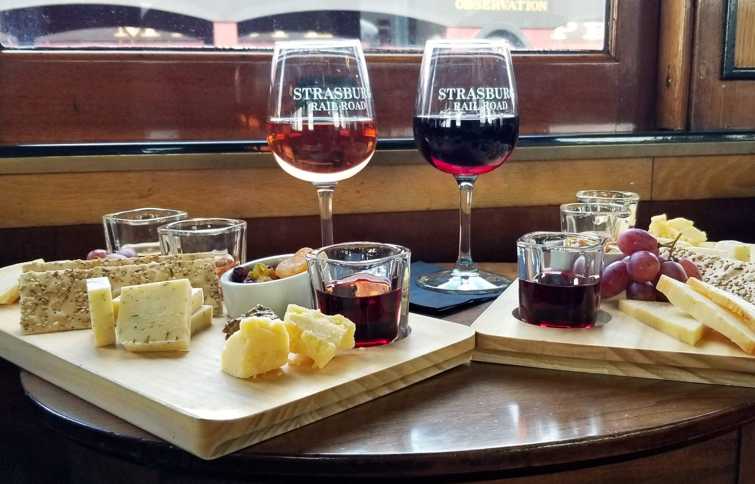 Two boards of cheese paired intentionally with wine.