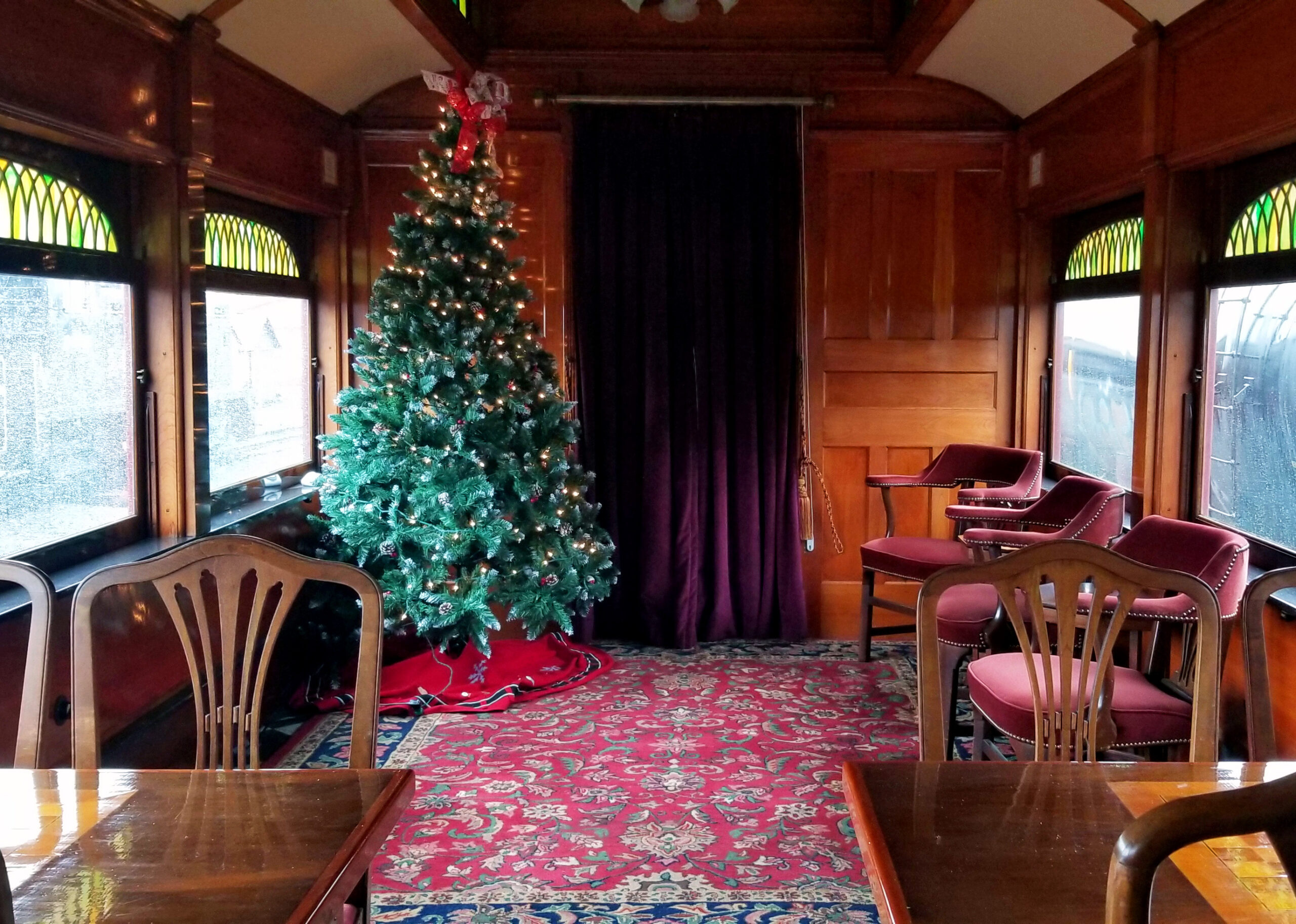 The club car on the train; decorated for Christmas.