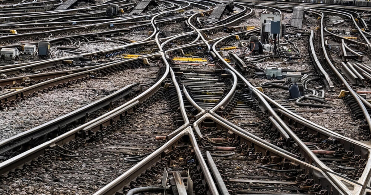 Twisted railroad tracks with multiple switches.