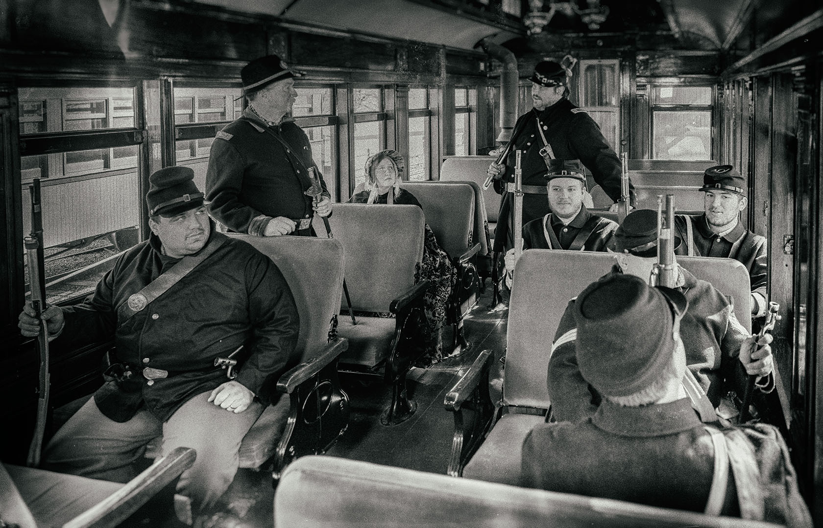 a group of people sitting at a train station