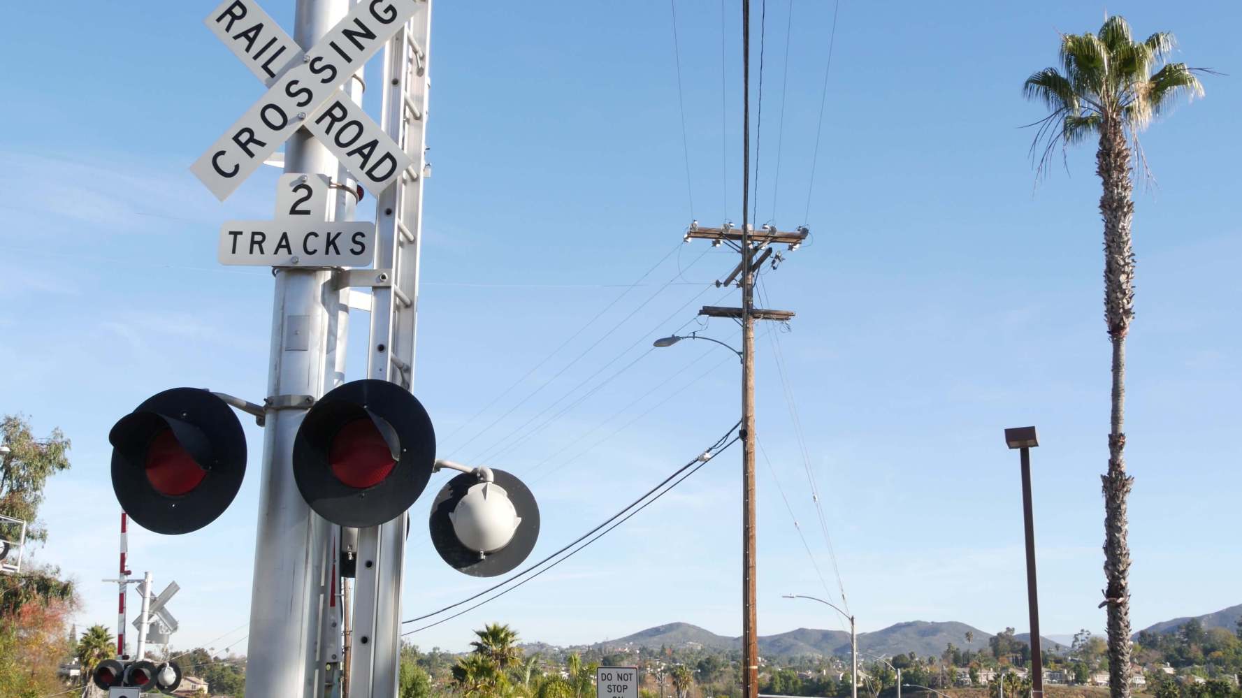 a railroad traffic light at a railroad crossing